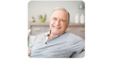 Middle-aged man smiling outdoors in a casual portrait